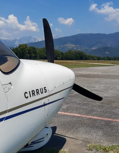 Cirrus SR20 Aircraft in Italy with mountains background