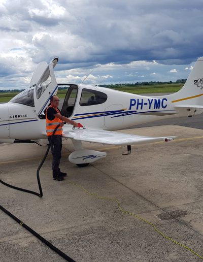 Cirrus SR20 Aircraft refueling with cloudy background